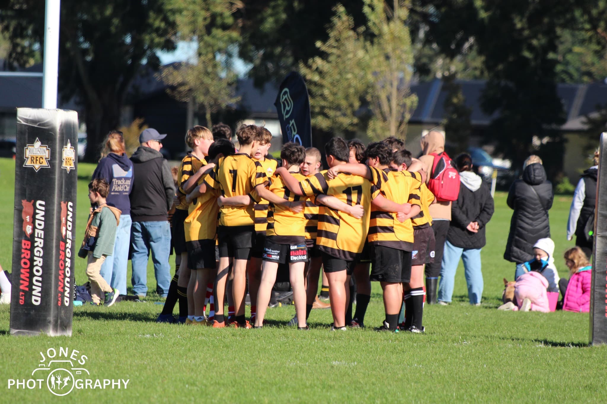 Young Rolleston RFC juniors walking together as a team